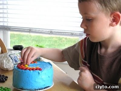 Mini Rainbow Layer Cake Recipe for Birthday Parties 2 child with small cake with blue frosting