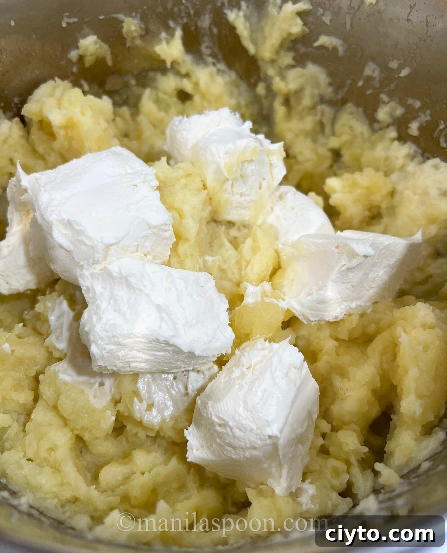 Adding butter and cream cheese