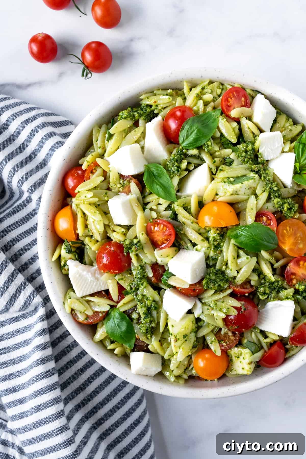 Pesto Orzo Salad in a white bowl.