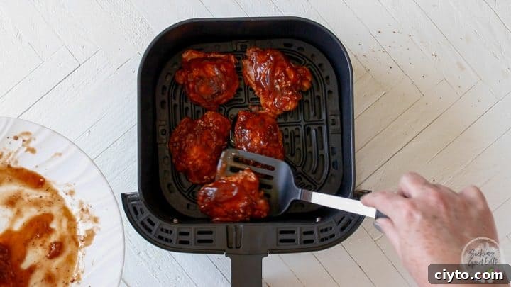 Adding the slow cooked chicken to an air fryer to give it a little browning and crisping.