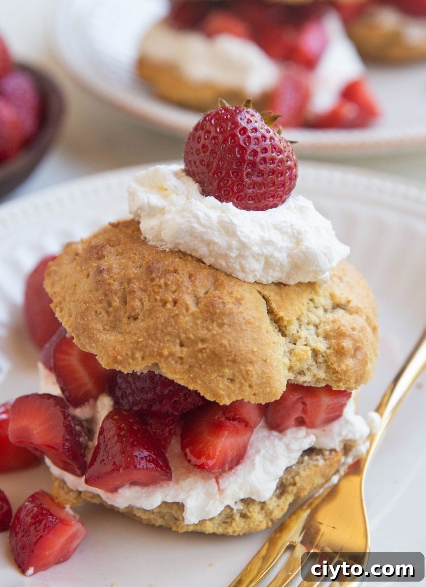 close up image of strawberry shortcake on a white plate
