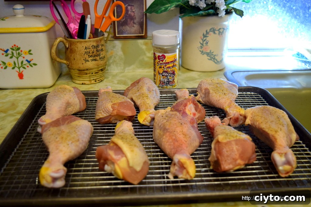 Seasoned chicken drumsticks before cooking