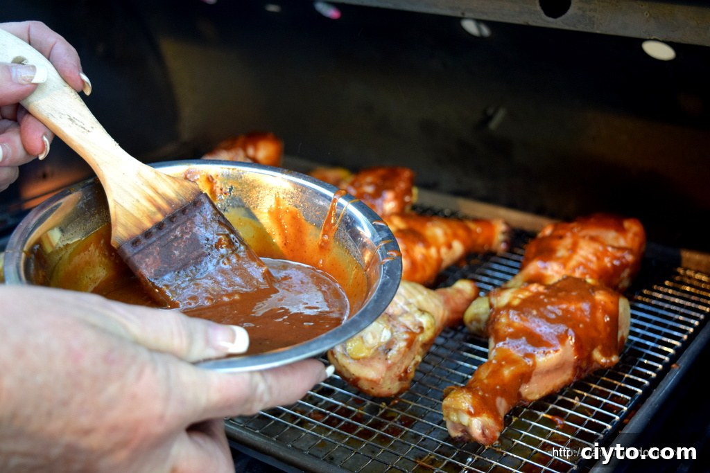 Brushing sauce on chicken during cook