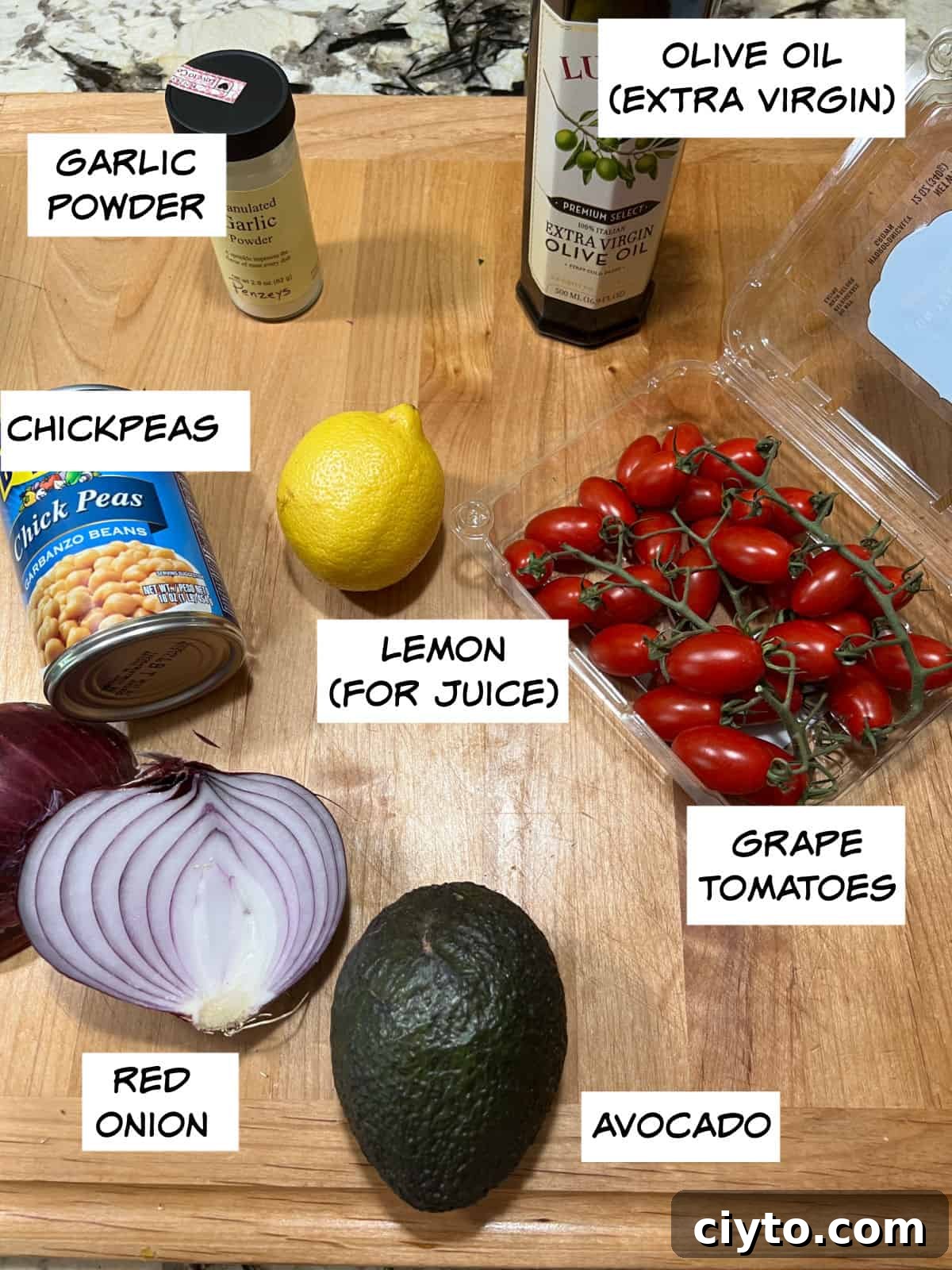 Chickpea and Avocado Salad Recipe 3 Ingredients: chickpeas, garlic powder, lemon for juice, olive oil, tomatoes, avocado, and red onion.