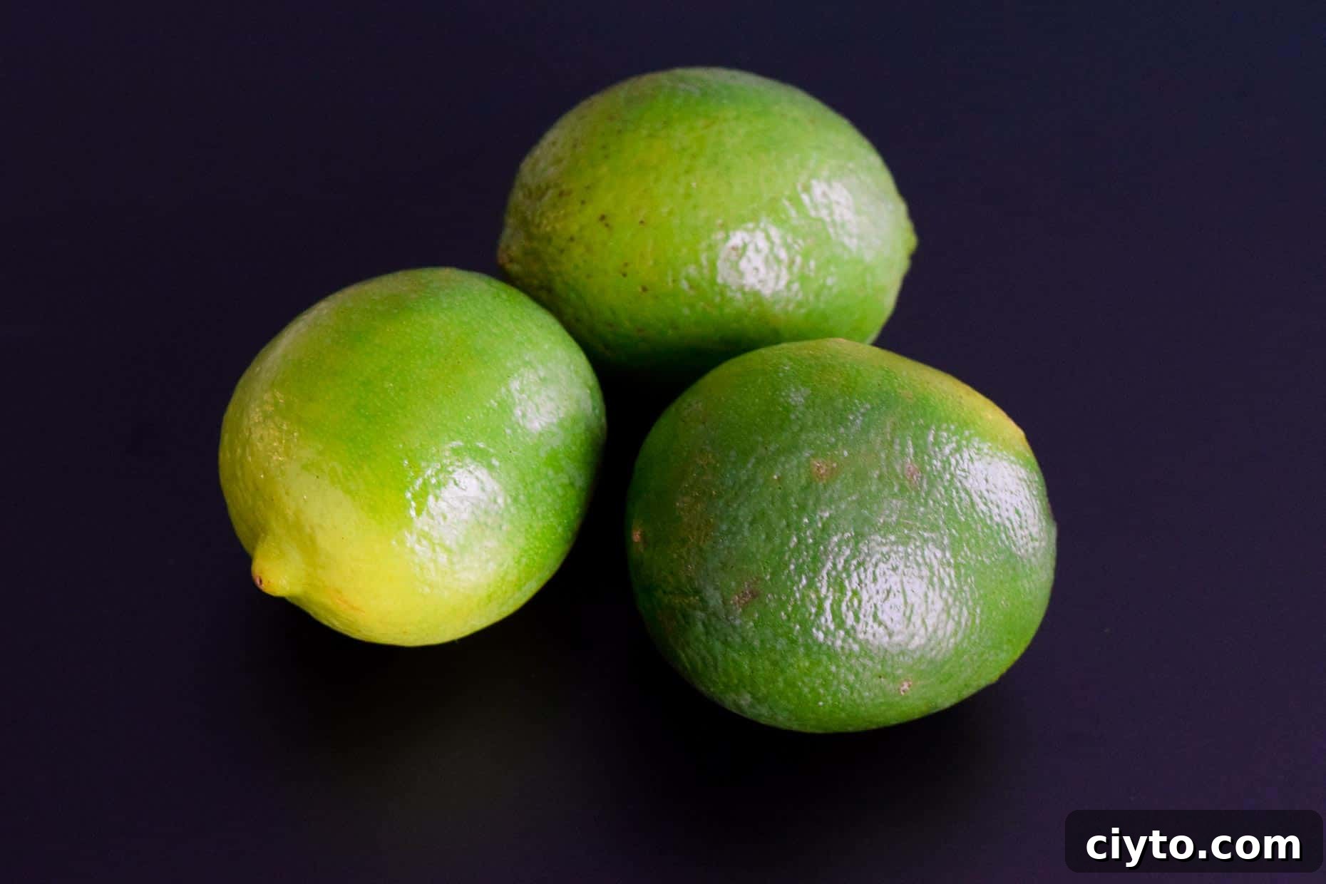 Limes on black background