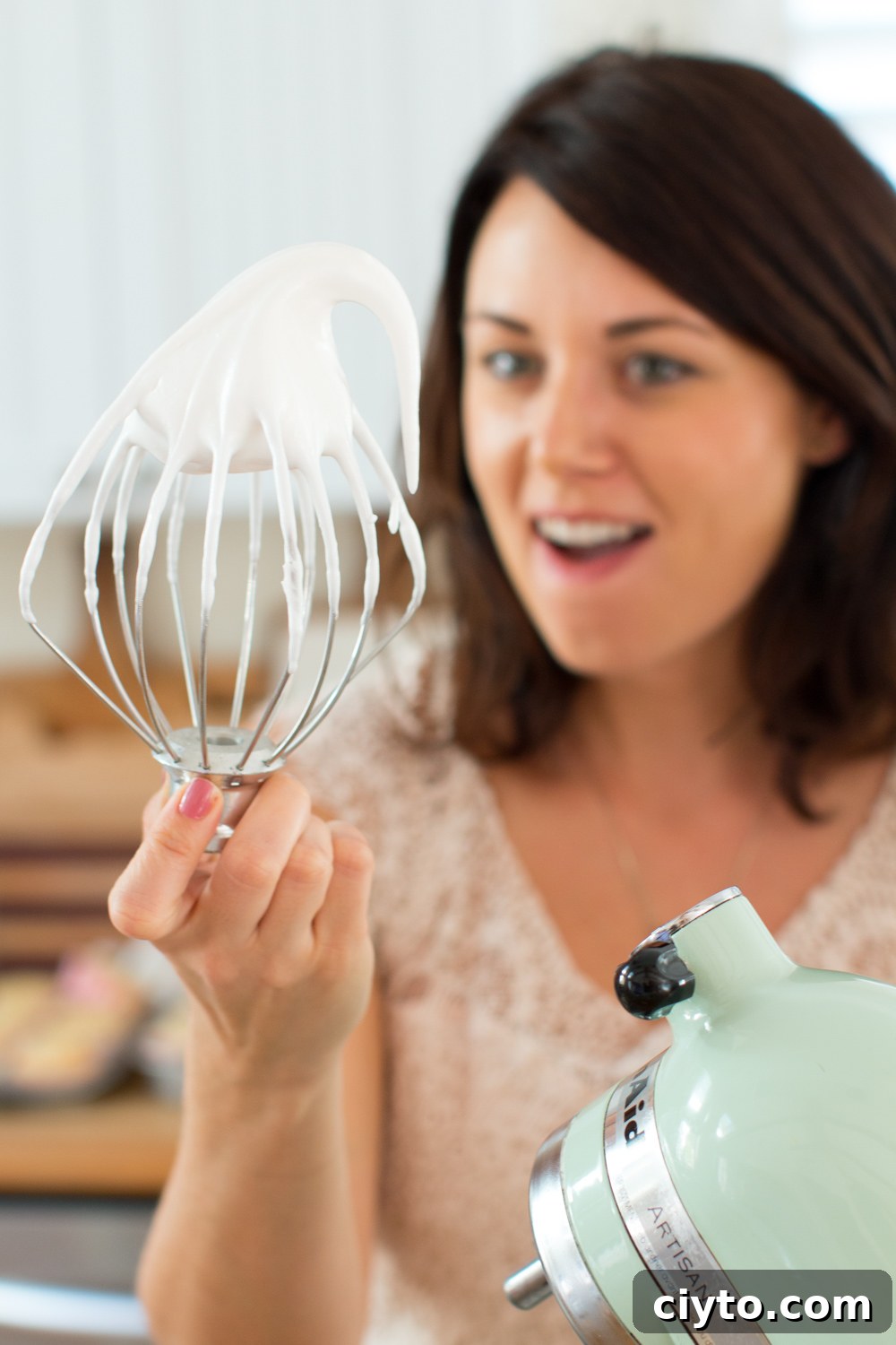 Becky Sue marvels at the meringue on the whisk
