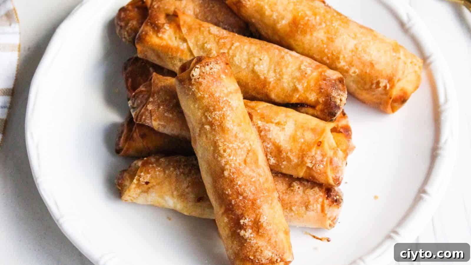A plate of freshly cooked Filipino banana turon lumpia spring rolls.