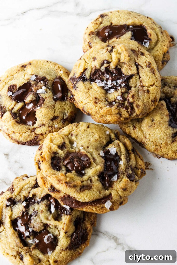 Egg Yolk Cookies Recipe: Crispy, Buttery Treats 10 Several cookies made with egg yolks on a white counter.