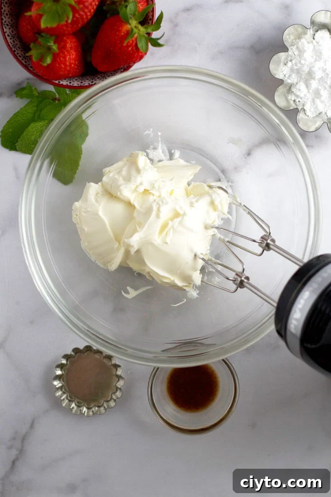 mascarpone in a glass bowl with a handmixer