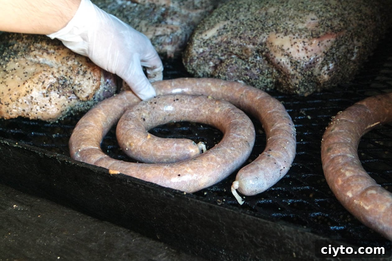 smoked sausage on the bbq pit