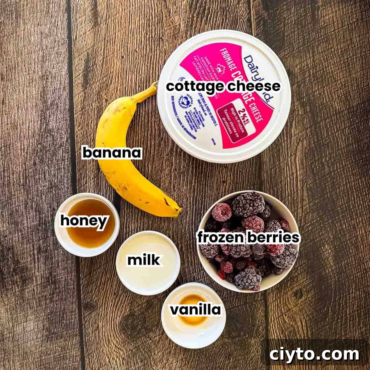 A labeled photo of the the simple ingredients needed to make the berry cottage cheese smoothie.