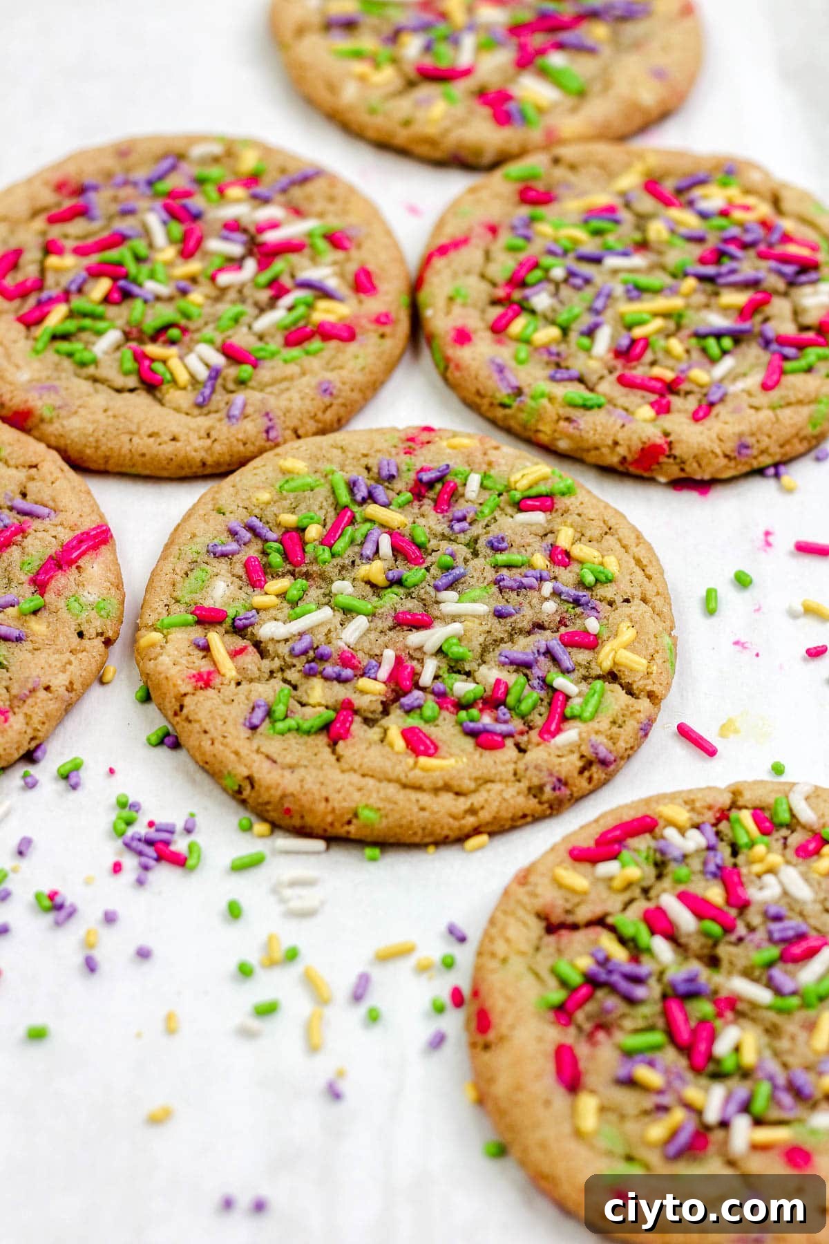 Sprinkle sugar cookies on a parchment paper lined baking sheet.