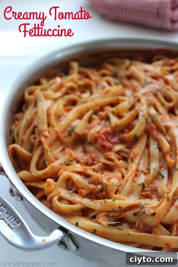 Creamy Tomato Fettuccine - perfect for a dinner side dish or even a meal. The pasta dish is creamy, full of flavor, and so easy to make. My family LOVES it!