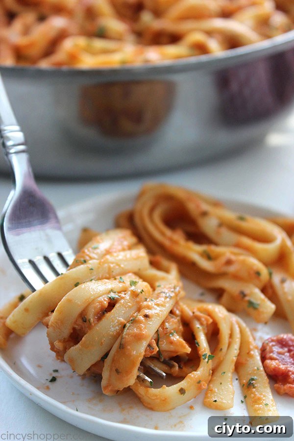 Creamy Tomato Fettuccine - perfect for a dinner side dish or even a meal. The pasta dish is creamy, full of flavor, and so easy to make. My family LOVES it!