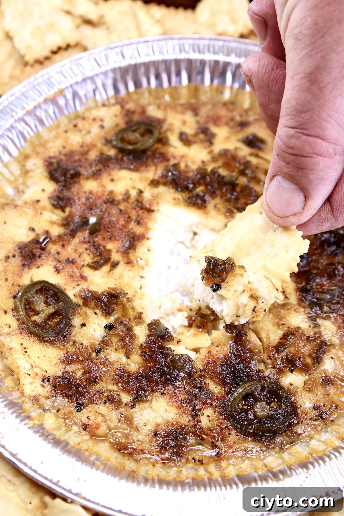 Cream cheese dip with jalapenos -dipping with a chip