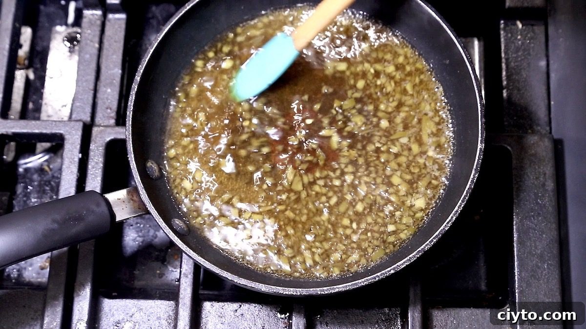 pan of diced jalapenos, water and brown sugar 