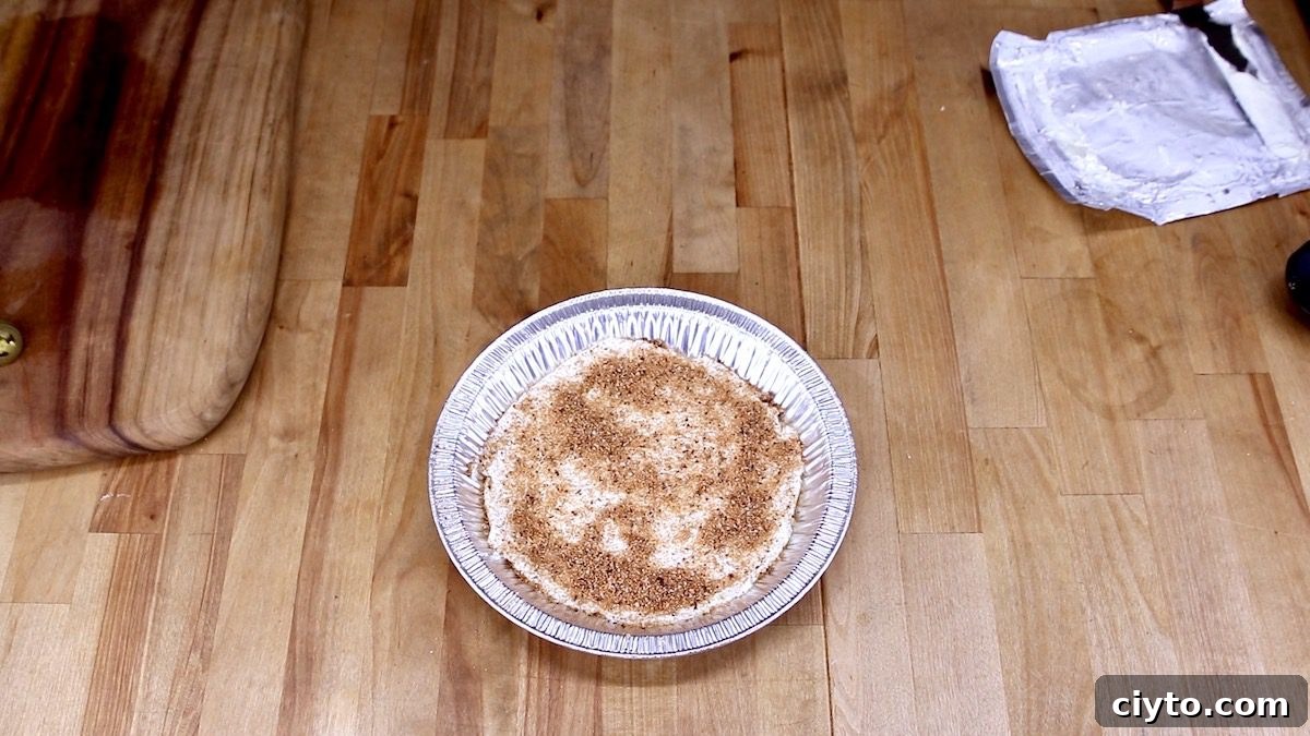 cream cheese with steak rub in a pan