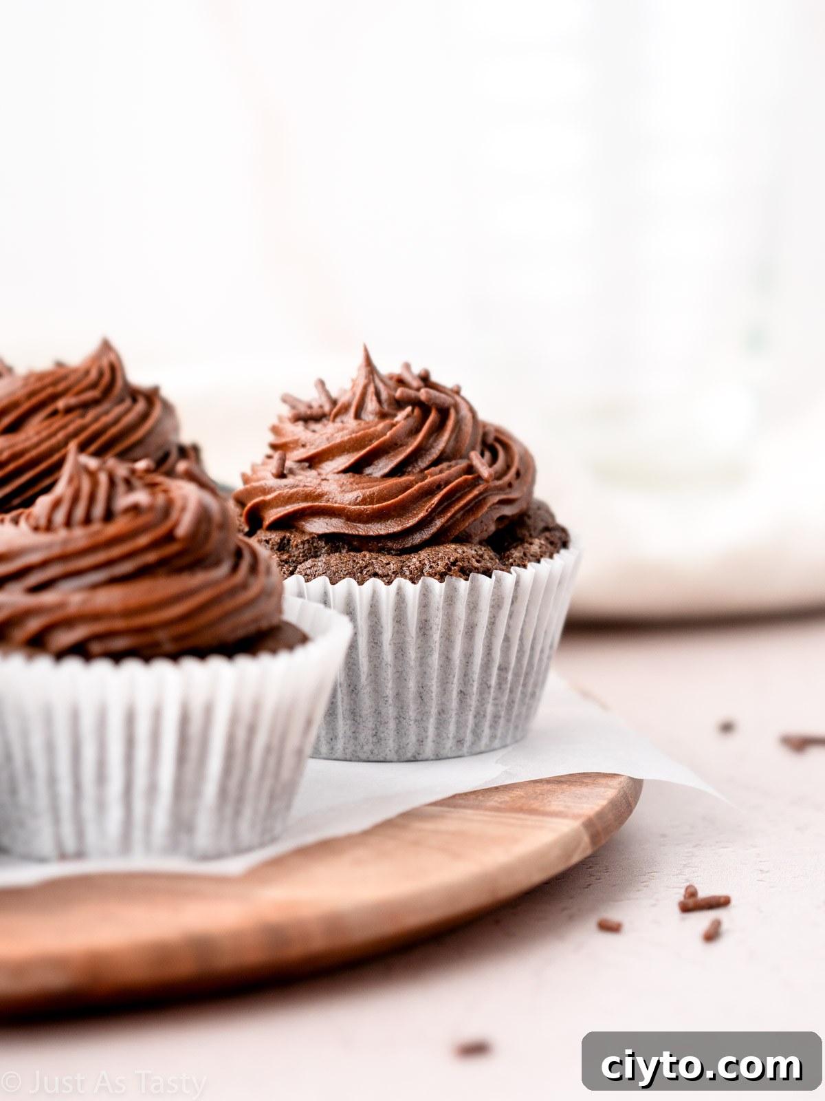Close-up of a frosted gluten free chocolate cupcake.
