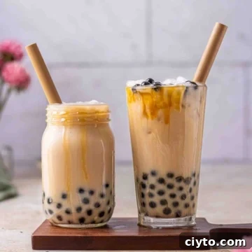Brown sugar bubble tea in a cup with straws.