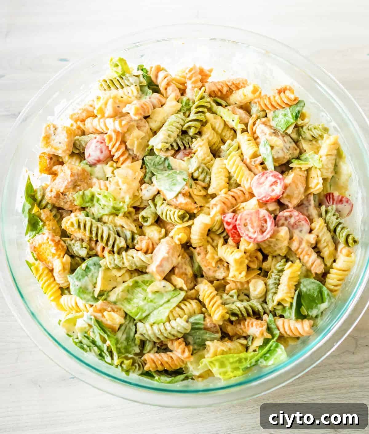Chicken Caesar Pasta Salad Recipe with Crispy Croutons 7 Caesar chicken pasta salad in large bowl.