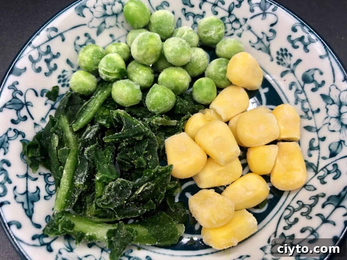 Frozen leaf spinach, corn, and peas.