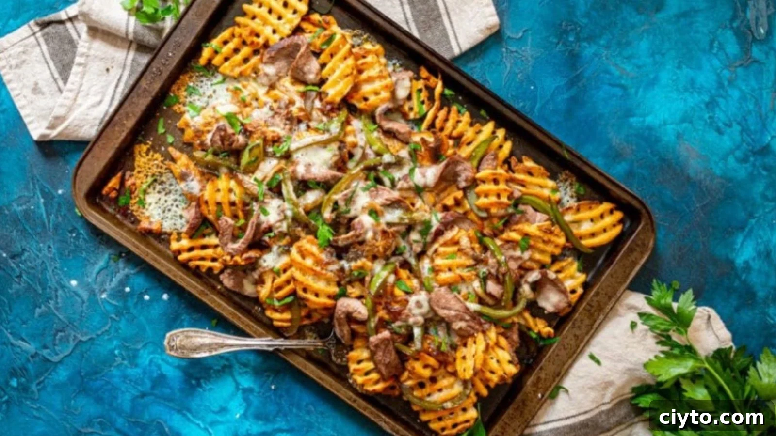 19 Crowd-Pleasing Appetizer Recipes Guests Can't Resist 2 Philly cheesesteak fries loaded with steak, peppers, and melted cheese.