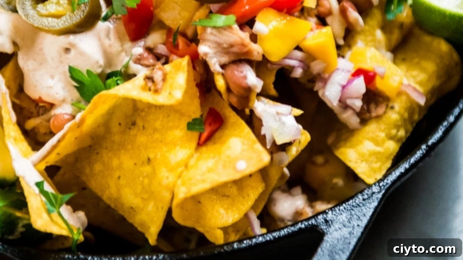 19 Crowd-Pleasing Appetizer Recipes Guests Can't Resist 3 Smoked chicken nachos topped with fresh mango salsa on crisp chips.