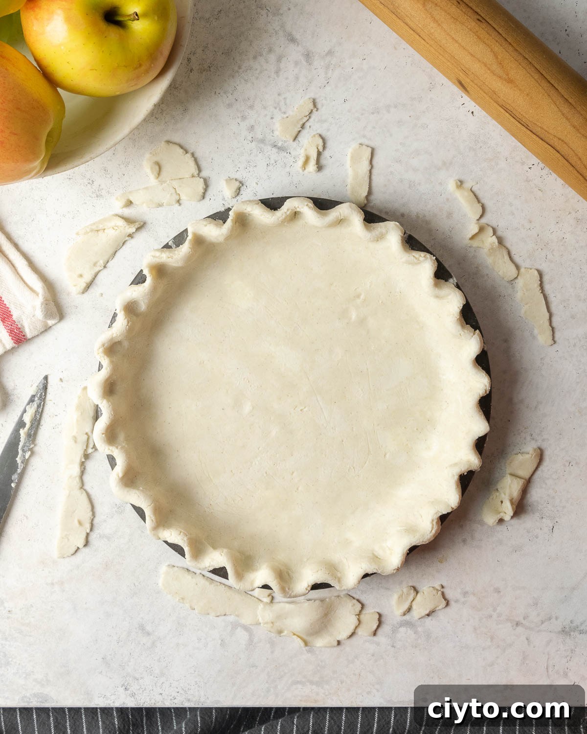 How to Make a Flaky Gluten-Free Pie Crust 2 An unbaked gluten free pie crust in a pie tin.