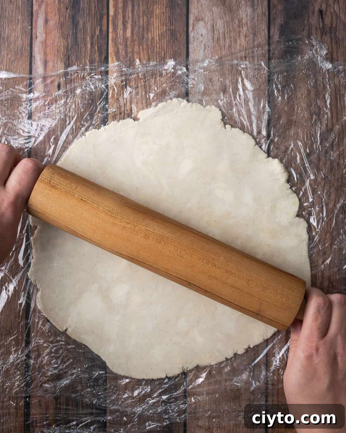 How to Make a Flaky Gluten-Free Pie Crust 16 A sheet of pie dough between two pieces of plastic wrap.