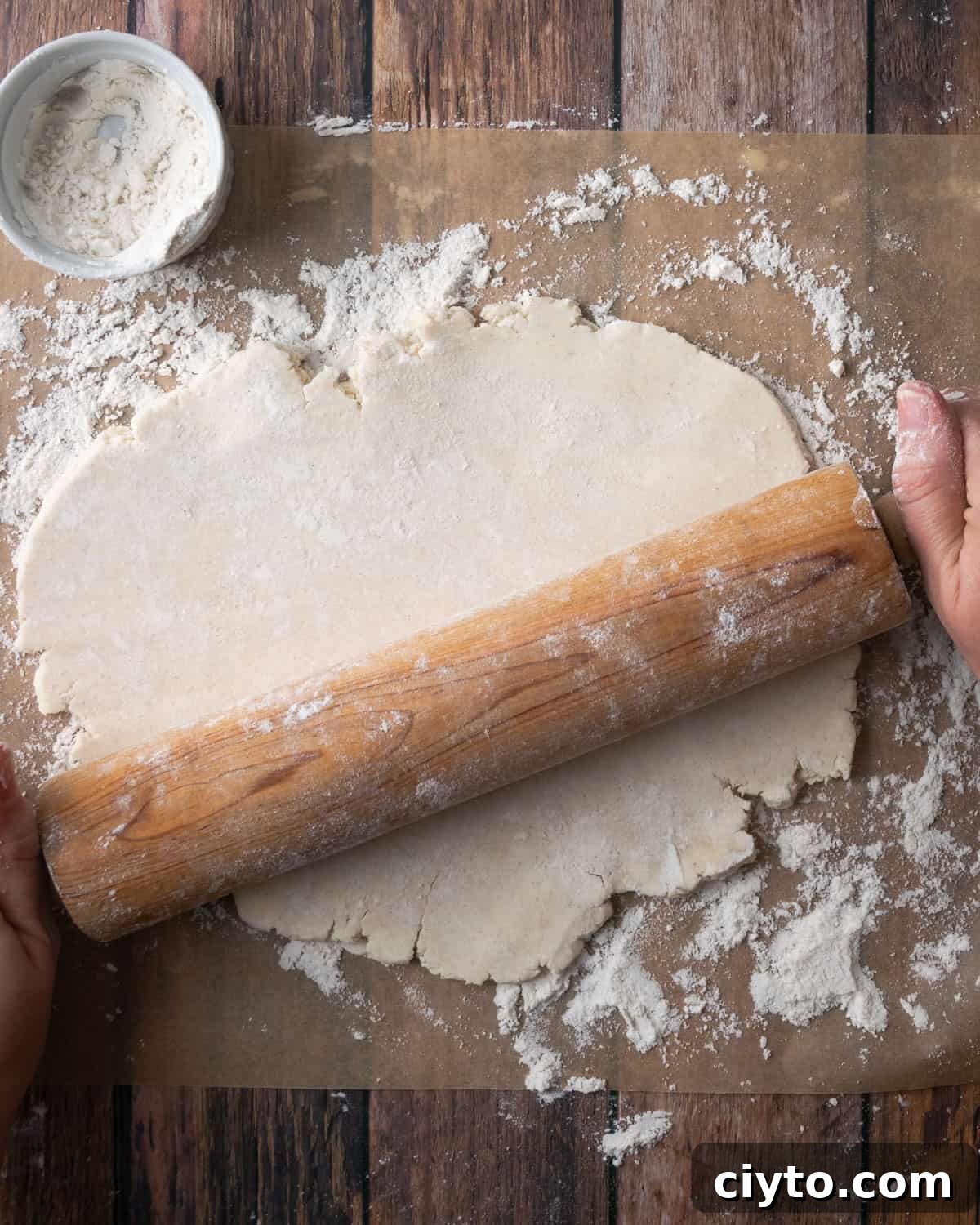 How to Make a Flaky Gluten-Free Pie Crust 18 A sheet of pie dough being rolled out on a floured surface.