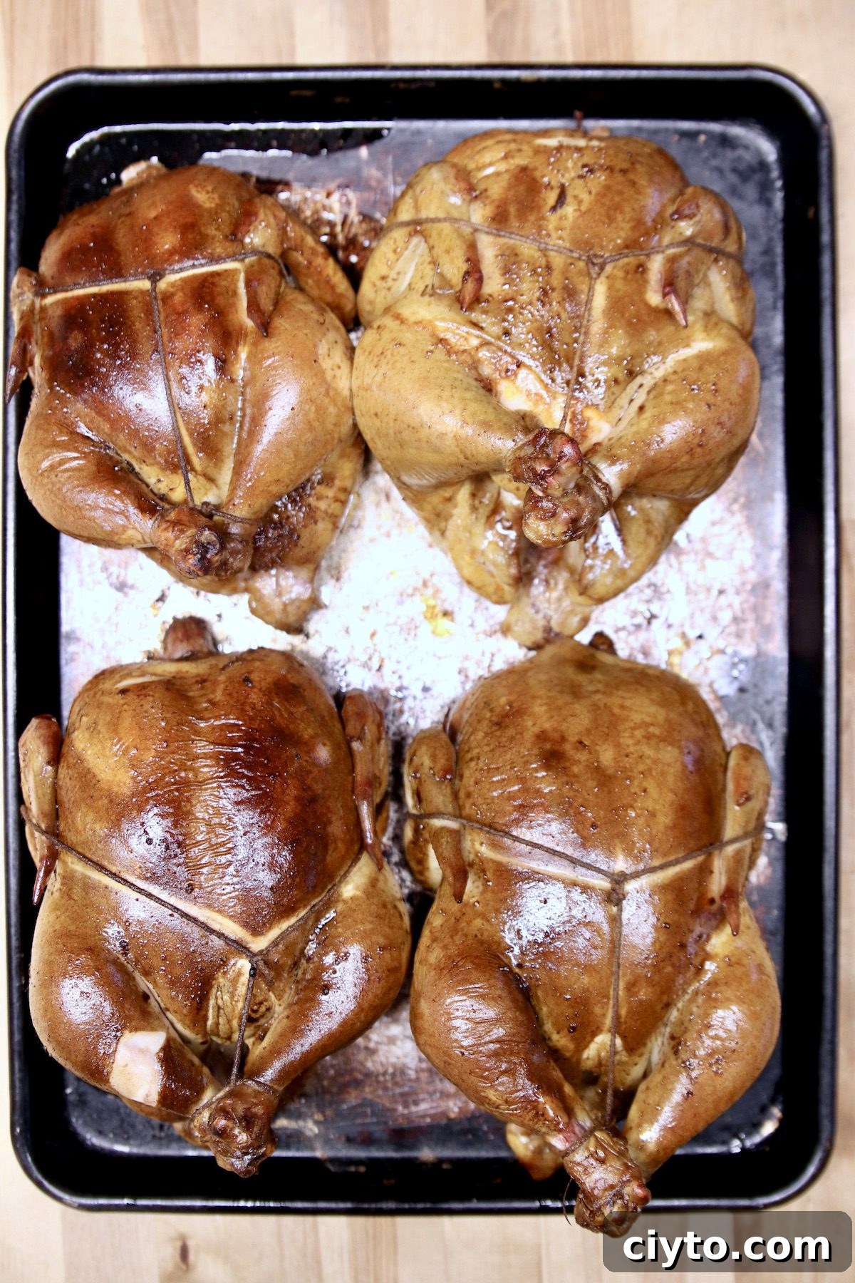 Meal Prep Chicken 4 whole grilled chickens on a baking sheet