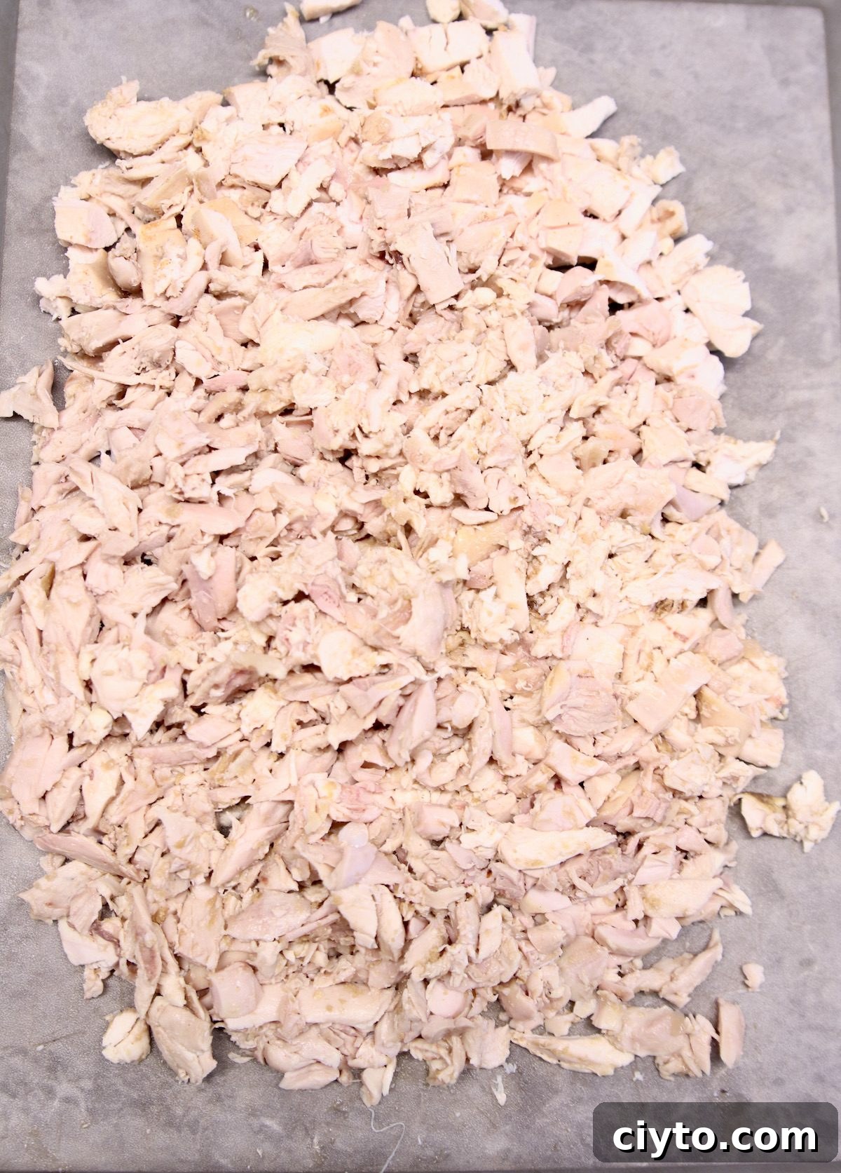 Meal prep chicken step by step chopped chicken on a cutting board