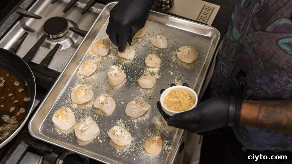 Garlic Butter Baked Scallops Recipe 7 sprinkling bread crumbs on top of scallops