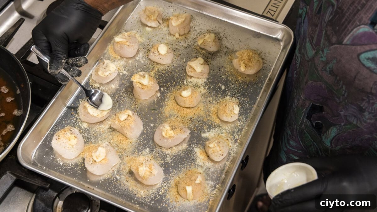 Garlic Butter Baked Scallops Recipe 8 brushing butter on scallops