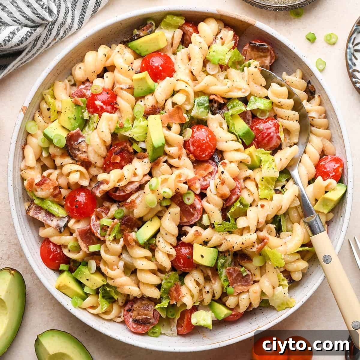 BLT Pasta Salad Recipe with Bacon, Tomato and Lettuce 2 BLT Pasta Salad in a bowl with a spoon