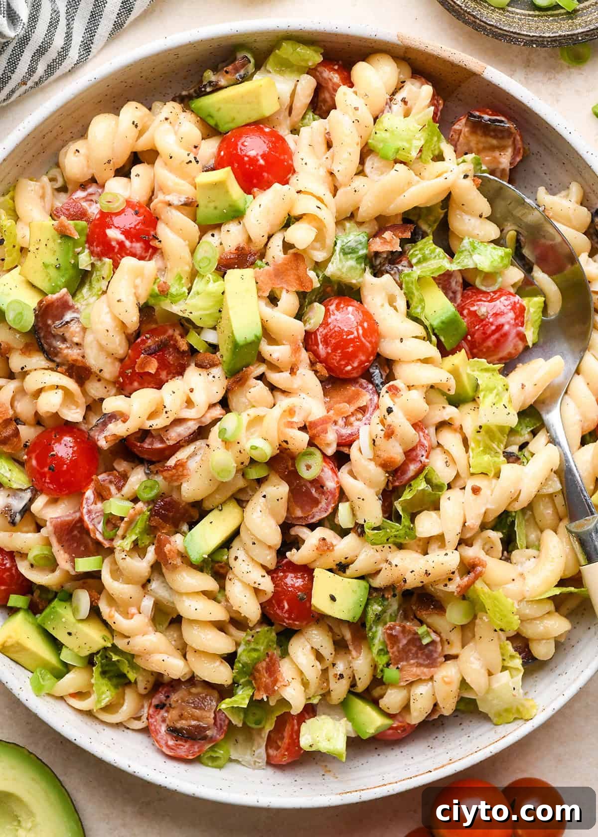 BLT Pasta Salad Recipe with Bacon, Tomato and Lettuce 18 BLT Pasta Salad in a bowl with a spoon