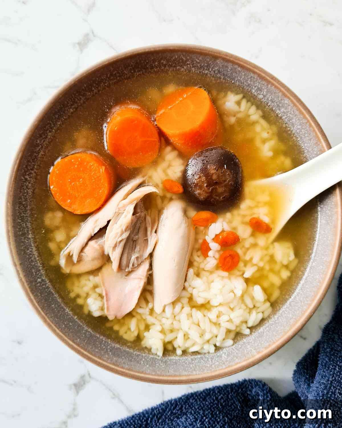 A bowl of clear soup with rice
