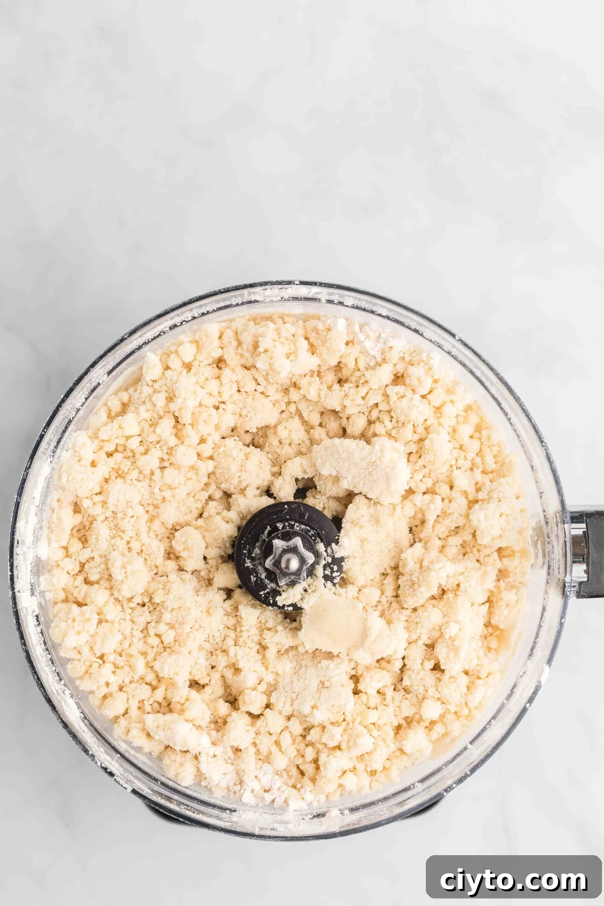 Crumbles of butter and flour in a bowl