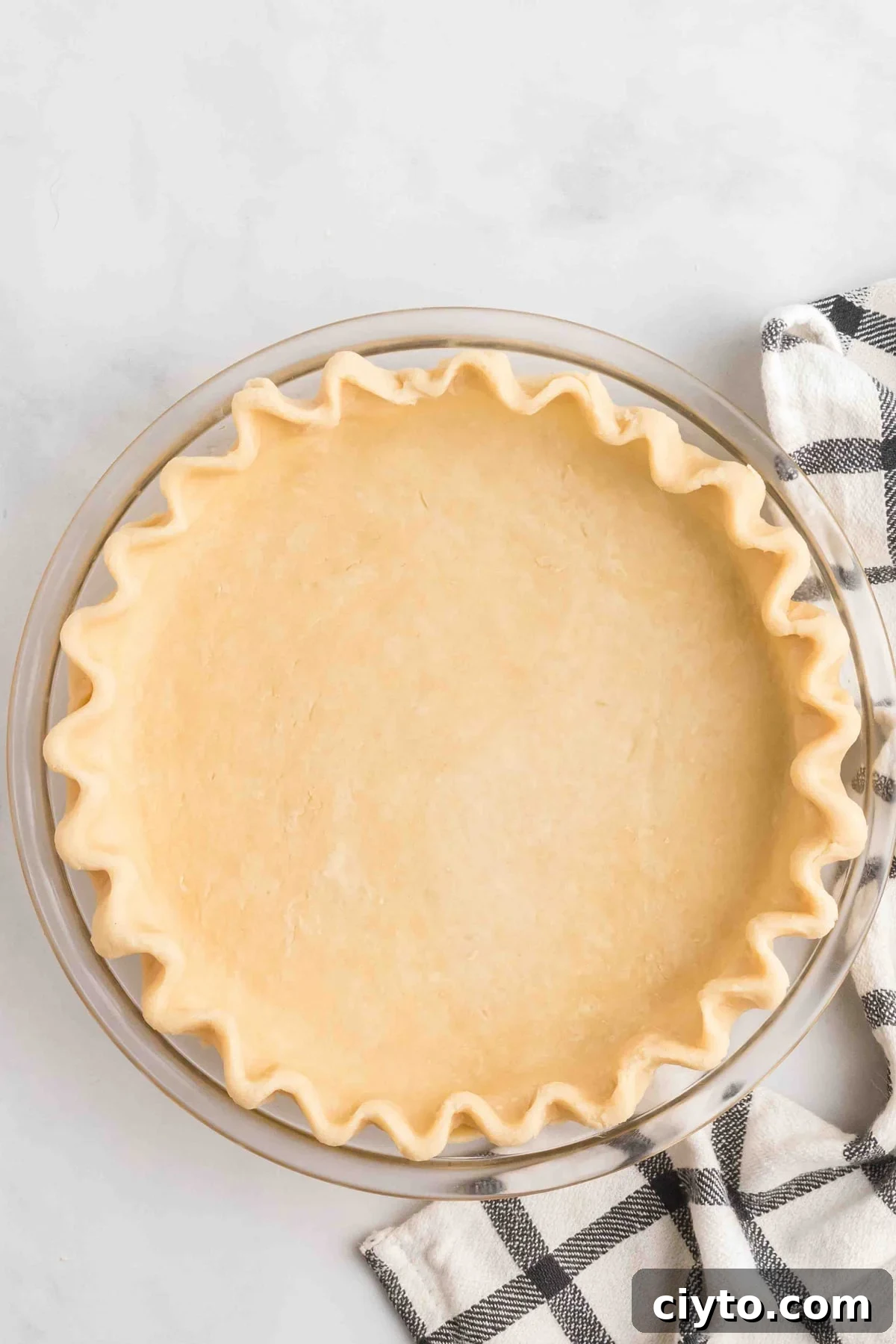 Overhead view of a pie crust in a pan