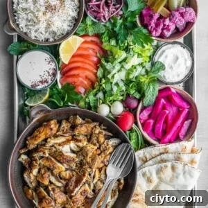 Chicken shawarma platter with all the sides and toppings.