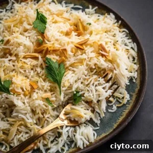 Rice with nuts and parsley on a plate.